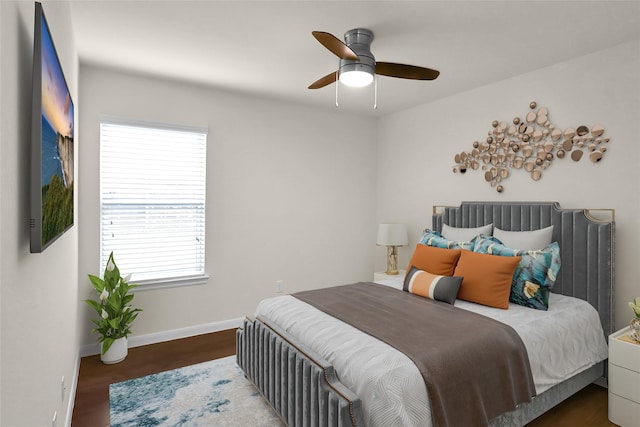 bedroom featuring hardwood / wood-style floors and ceiling fan