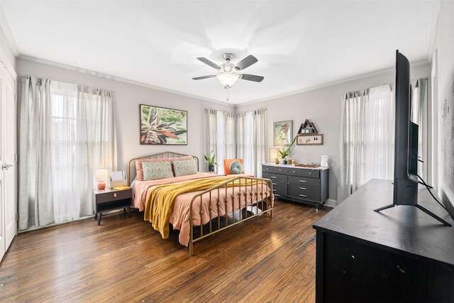 bedroom with dark wood-type flooring, ceiling fan, and ornamental molding