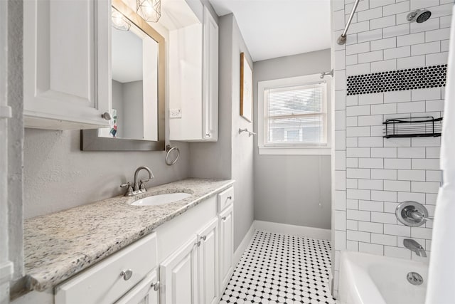 bathroom featuring vanity and shower / bathtub combination with curtain