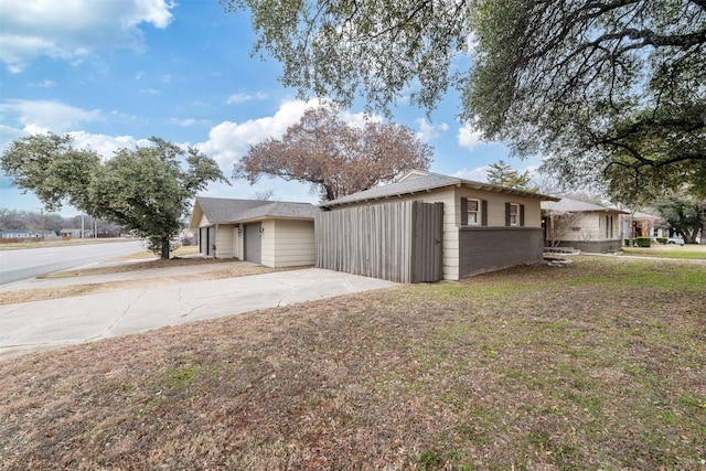 view of side of property featuring a yard