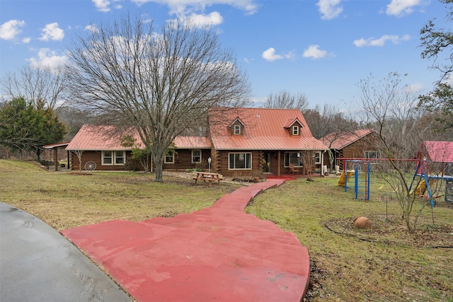 view of front of property with a front lawn and a playground