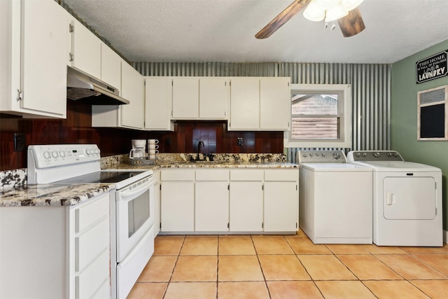 kitchen with white cabinetry, washer and dryer, white electric range, and light tile patterned flooring