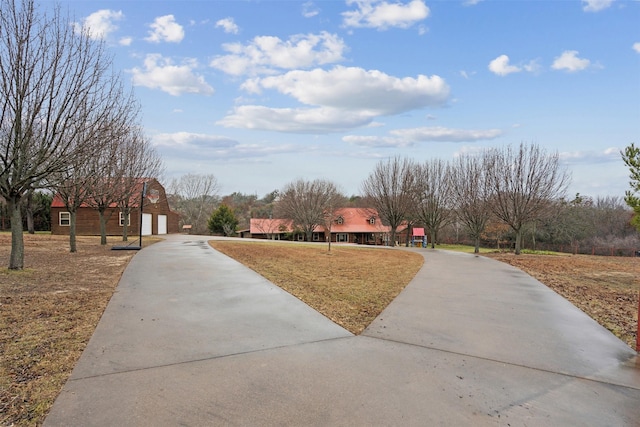 exterior space featuring a garage and a yard