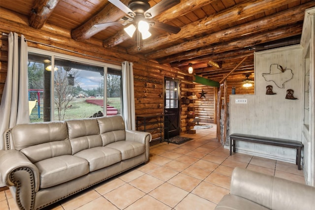 tiled living room with beamed ceiling, ceiling fan, log walls, and wooden ceiling