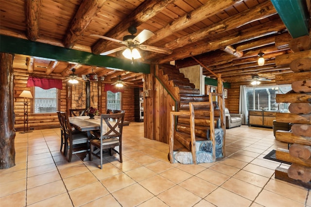 tiled dining space with beam ceiling, wood ceiling, and ceiling fan