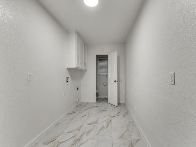 clothes washing area with cabinets, hookup for a washing machine, and electric dryer hookup