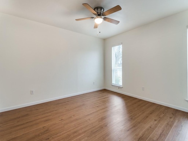 spare room with ceiling fan and hardwood / wood-style floors