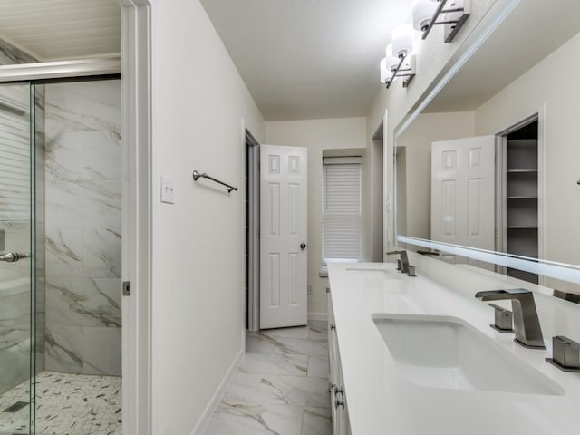 bathroom featuring vanity and a shower with shower door