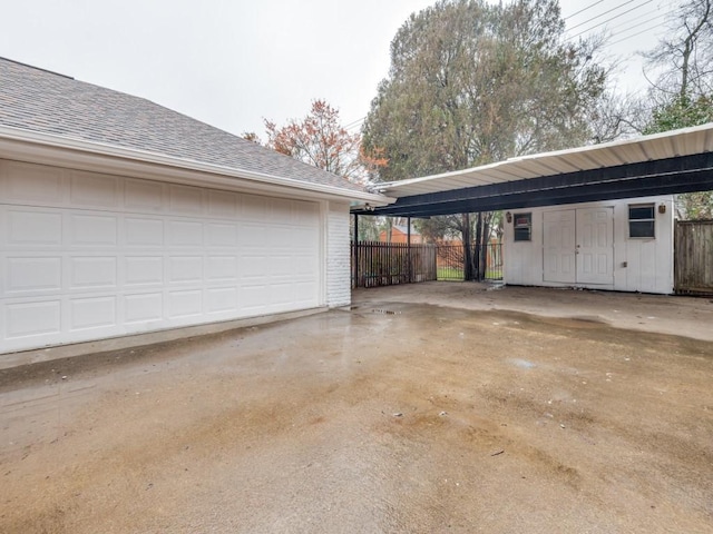 garage featuring a carport