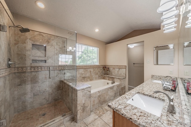 full bath featuring a bath, a sink, double vanity, vaulted ceiling, and a stall shower