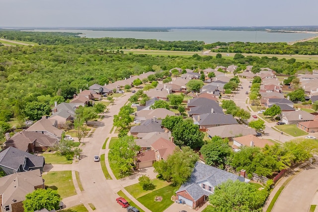 drone / aerial view featuring a residential view and a water view