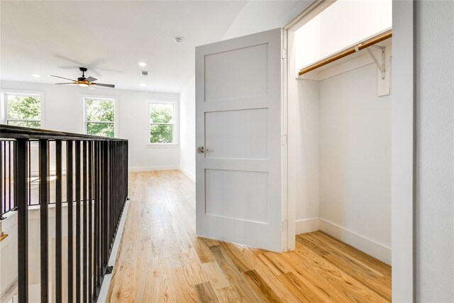 bedroom with light carpet and ceiling fan