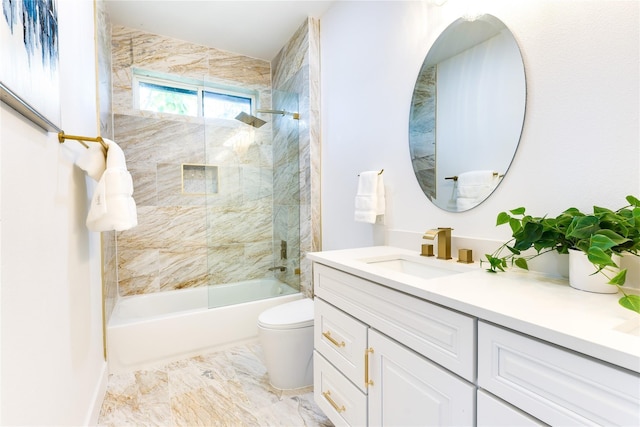 full bathroom featuring vanity, toilet, and tiled shower / bath