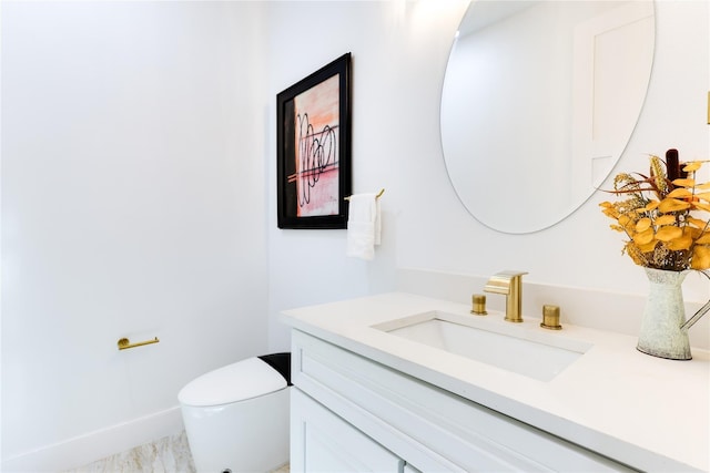 bathroom with vanity and toilet