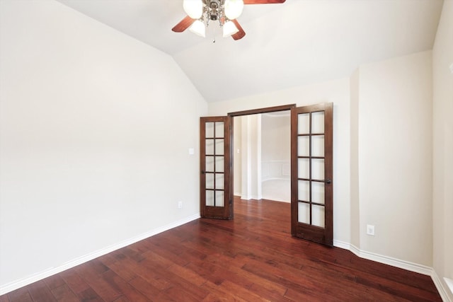 unfurnished room with french doors, ceiling fan, vaulted ceiling, and dark wood-type flooring