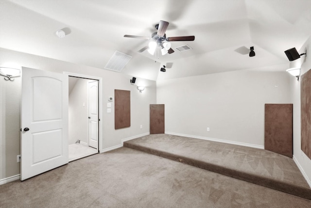 carpeted empty room with lofted ceiling and ceiling fan