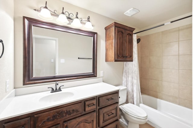 full bathroom featuring shower / bath combination with curtain, vanity, and toilet