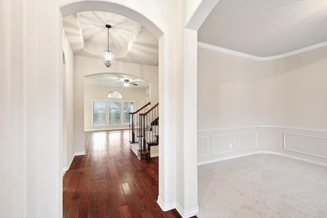 corridor with crown molding and dark hardwood / wood-style floors