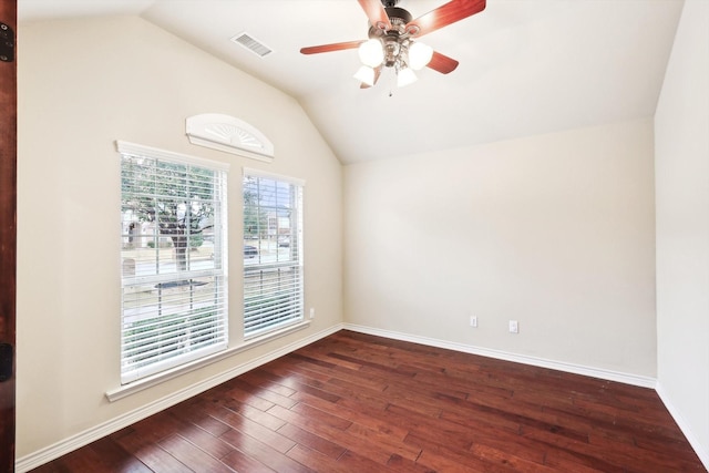 spare room with vaulted ceiling, dark hardwood / wood-style floors, and ceiling fan