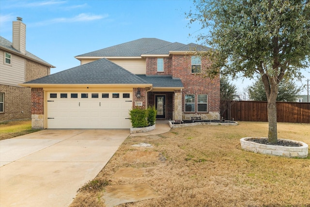 front facade featuring a garage and a front yard