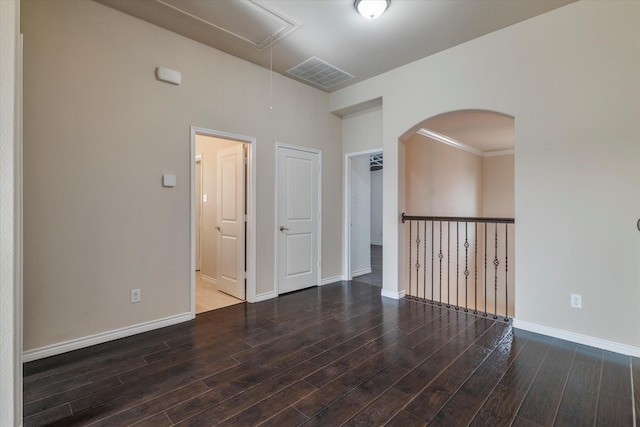 unfurnished room featuring dark hardwood / wood-style flooring