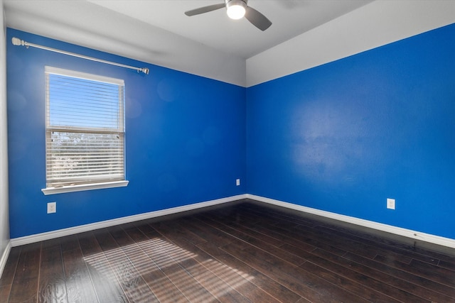 spare room with hardwood / wood-style flooring and ceiling fan