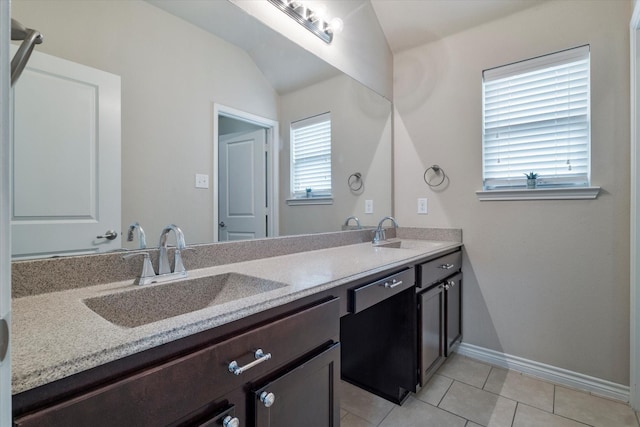 bathroom featuring tile patterned floors, vanity, and lofted ceiling