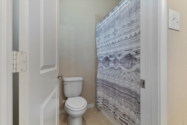 bathroom featuring tile patterned floors and toilet