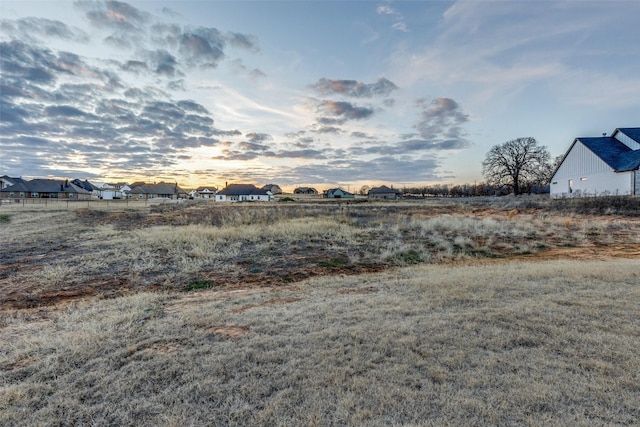 view of yard at dusk