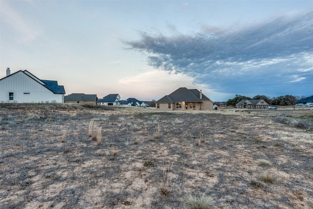 view of yard at dusk