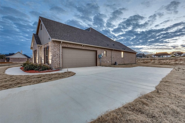 view of side of property with a garage