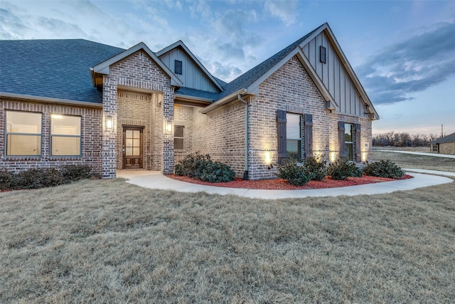 craftsman-style house with a lawn