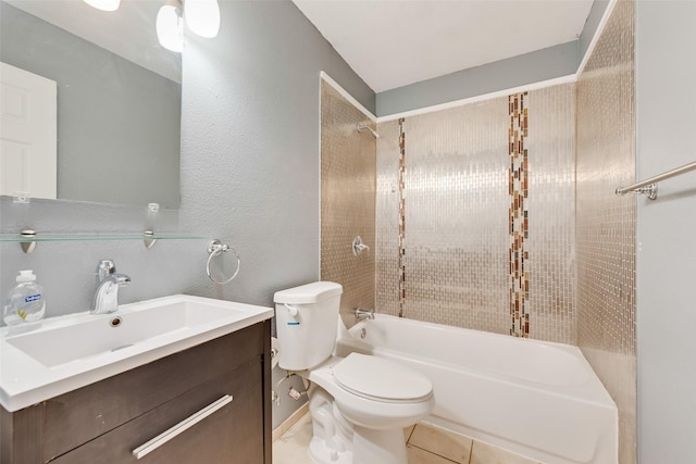 full bathroom featuring tiled shower / bath combo, vanity, tile patterned flooring, and toilet