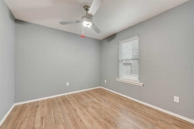 empty room with ceiling fan and light wood-type flooring