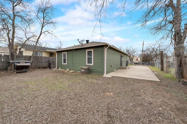 rear view of property with a patio area