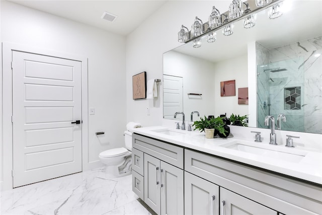 bathroom with vanity, toilet, and a shower with shower door