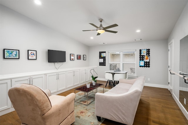 living room featuring hardwood / wood-style flooring, ceiling fan, and lofted ceiling