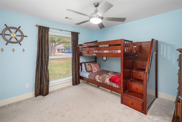 bedroom featuring ceiling fan and light colored carpet