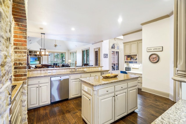 kitchen with pendant lighting, sink, light stone counters, a kitchen island, and stainless steel dishwasher