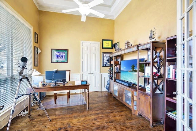 home office with ceiling fan, crown molding, dark hardwood / wood-style flooring, and a towering ceiling