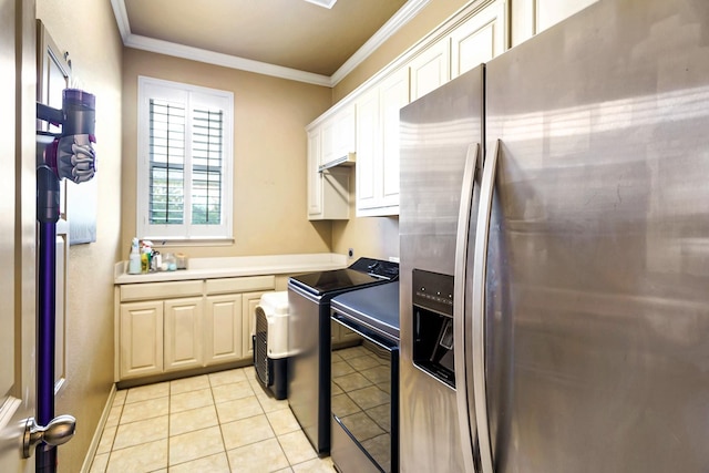 kitchen featuring stove, light tile patterned flooring, crown molding, stainless steel fridge, and white cabinets