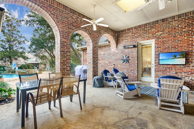 view of patio featuring ceiling fan