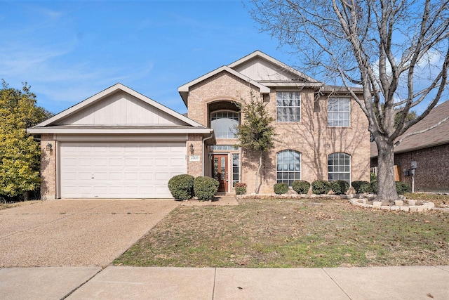 view of front of home with a garage and a front yard