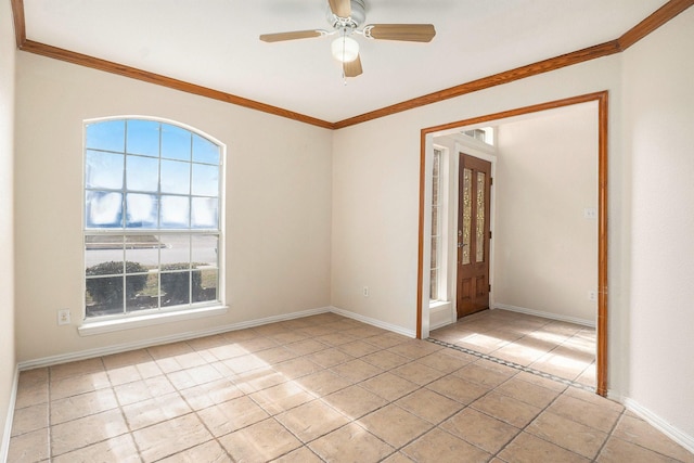 tiled empty room featuring crown molding and ceiling fan