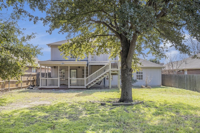 back of house with a yard, ceiling fan, and a deck