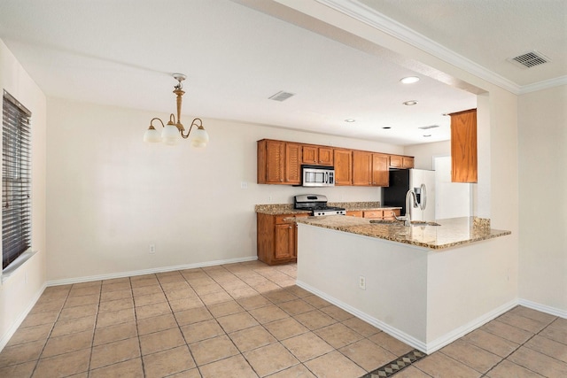 kitchen featuring light tile patterned flooring, sink, hanging light fixtures, stainless steel appliances, and light stone countertops