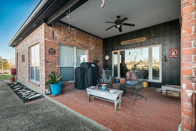 view of patio / terrace with ceiling fan and a grill