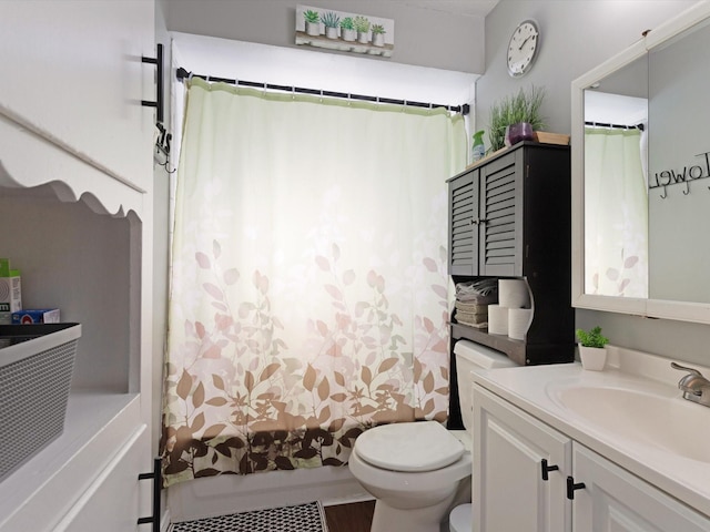 full bathroom featuring shower / bath combination with curtain, vanity, and toilet