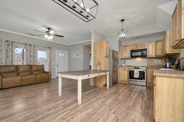 kitchen featuring sink, appliances with stainless steel finishes, ornamental molding, decorative light fixtures, and light brown cabinets