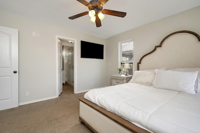 bedroom with light carpet, connected bathroom, and ceiling fan